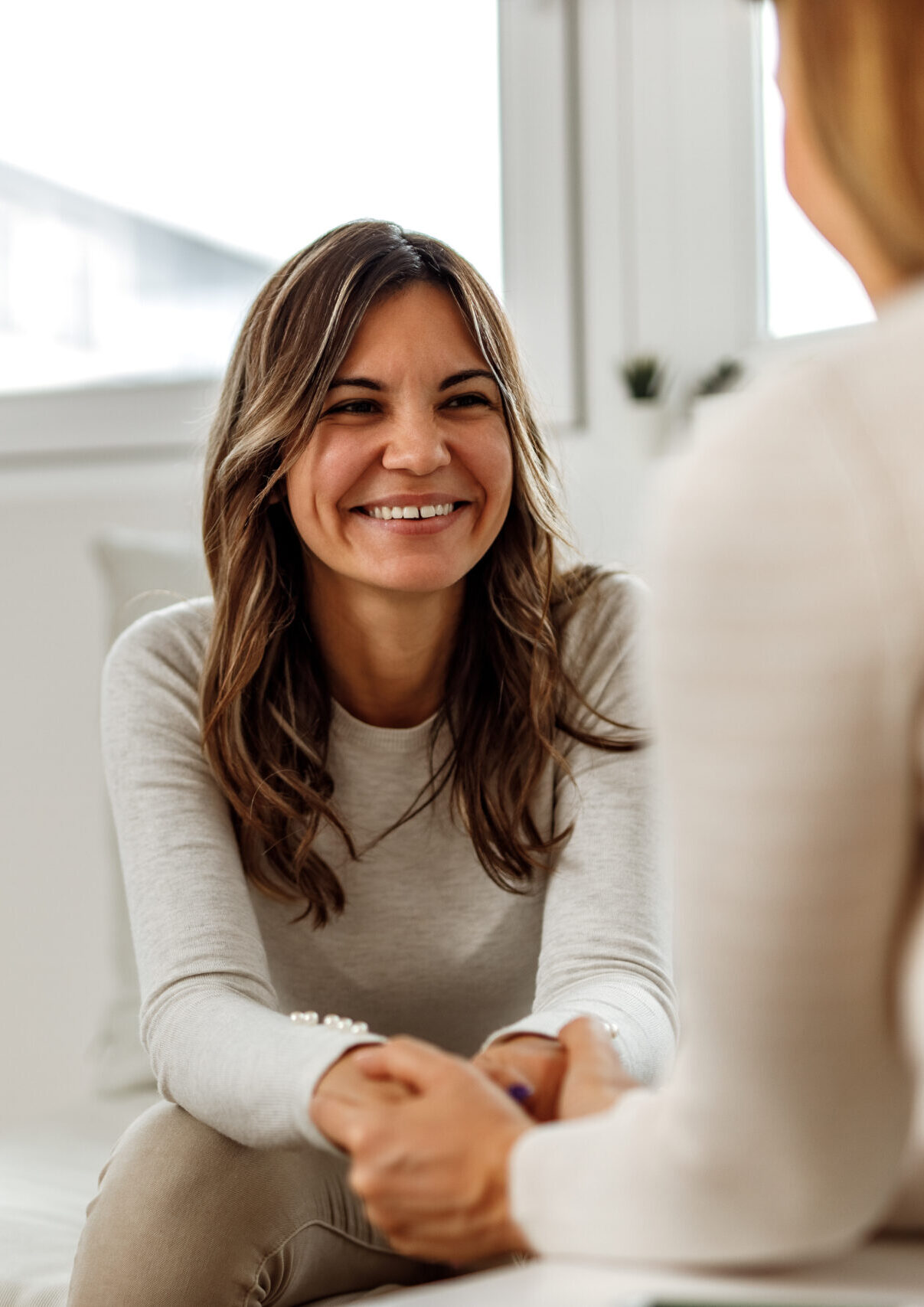 one on one therapy Smiling woman, talking to psychologist, feeling positive.