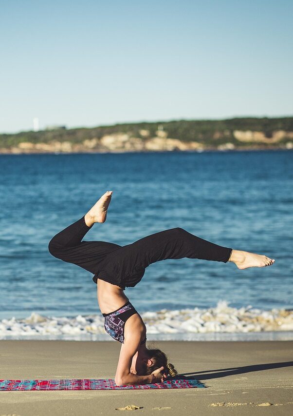 yoga-1842292_1280 Person practicing yoga on beach. Mind Body Wellness at Kinetic Mind